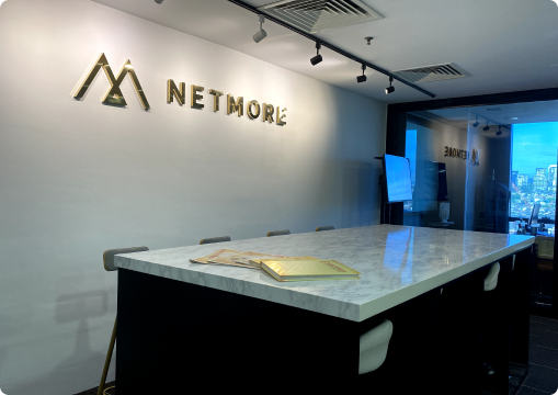 Modern Netmore office meeting area with company logo, representing a professional and collaborative career environment in Malaysia.
