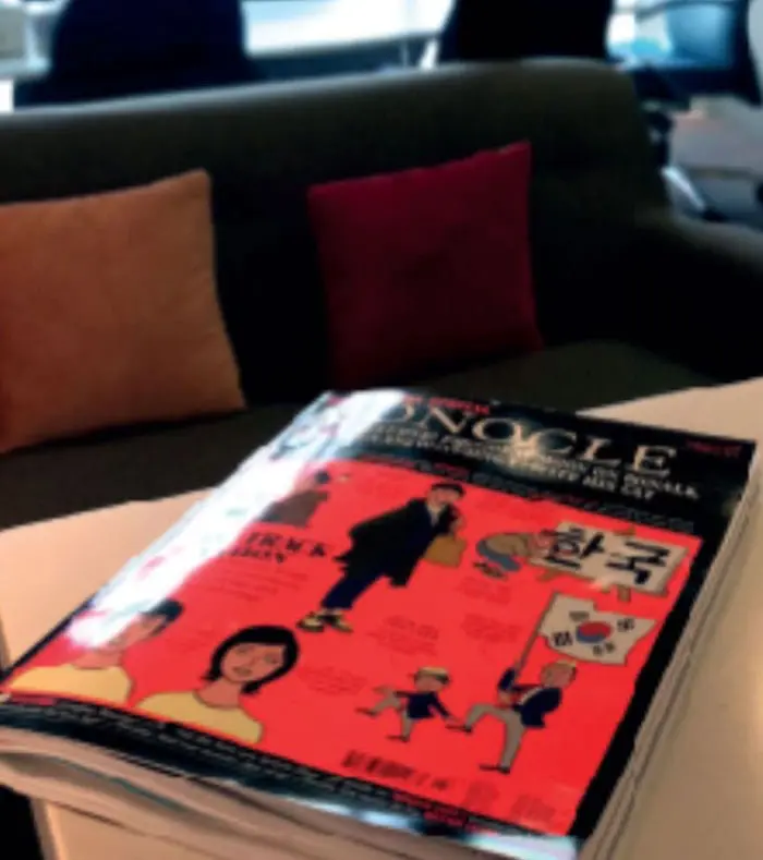 Creative lounge area at Netmore office with a magazine on the table, reflecting the agency’s modern and inspiring work environment as a web design agency in Malaysia.