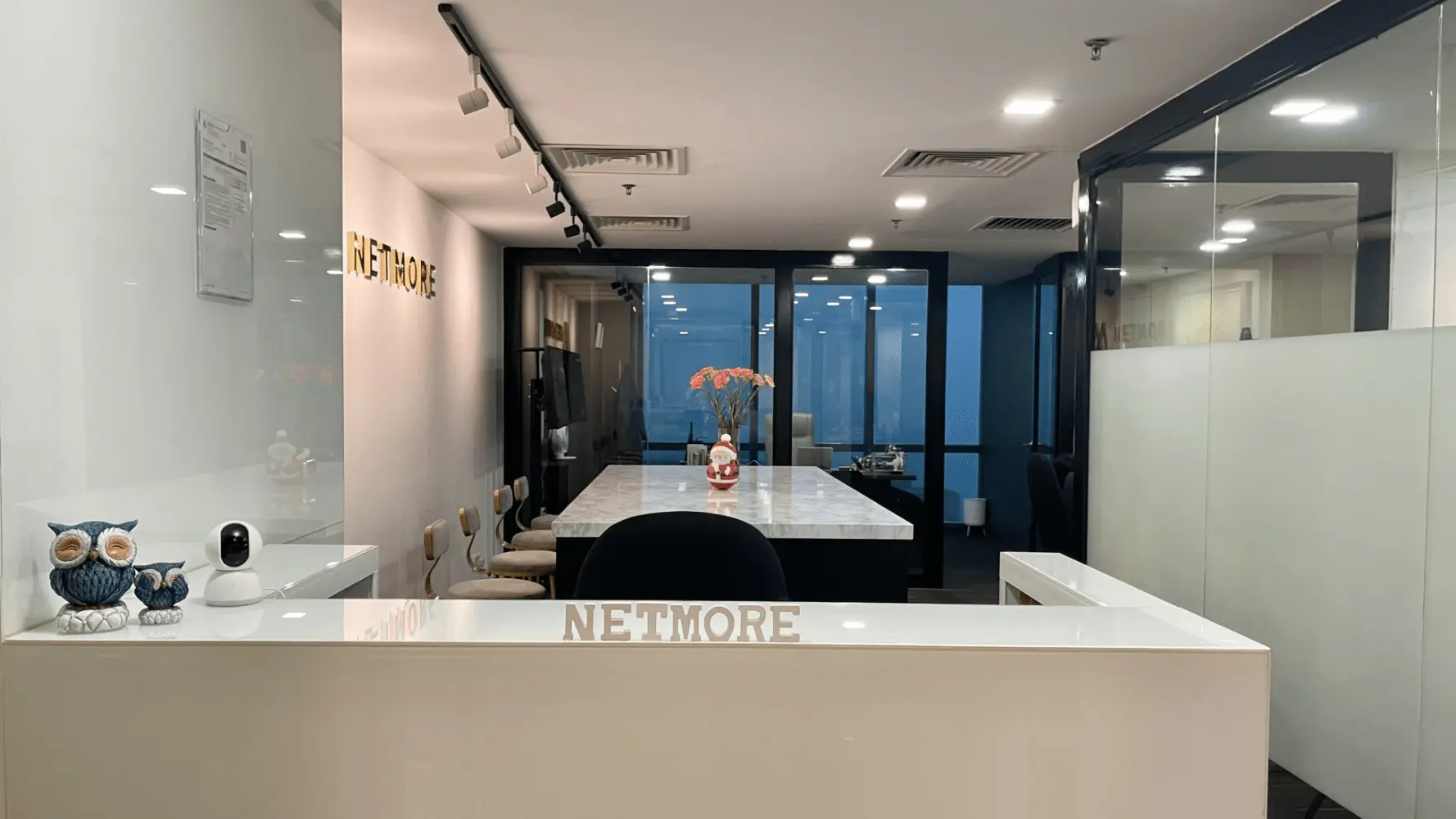 Modern office interior of Netmore, a leading web design agency in Malaysia, showcasing a clean workspace and welcoming environment.