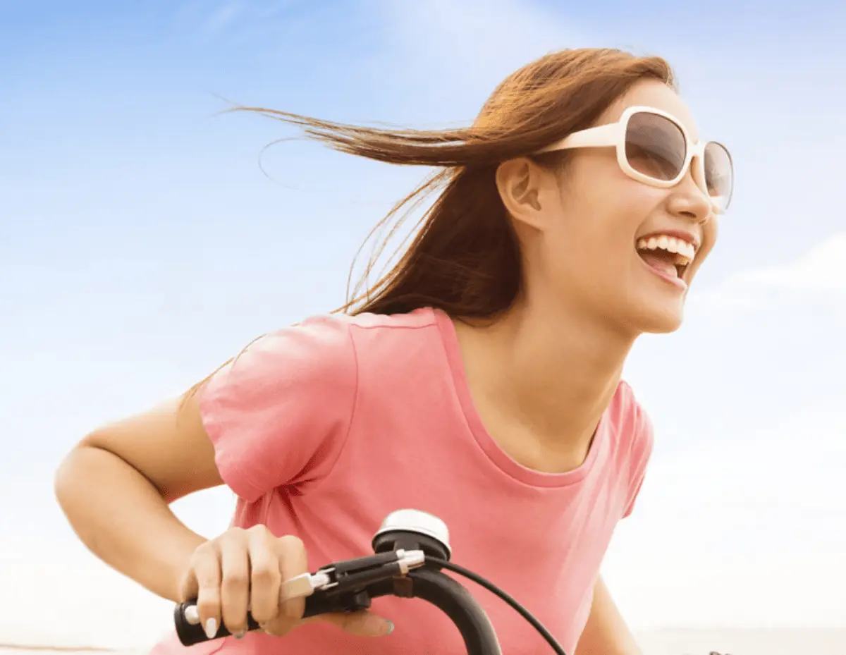 Woman smiling with confidence after website maintenance improvement in Malaysia.
