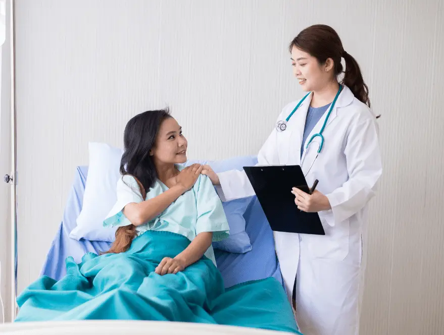Doctor consulting patient in hospital setting. Example of healthcare web design project Malaysia.