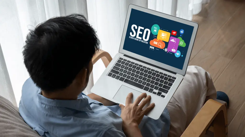 Professional performing Google SEO Malaysia analysis on laptop showing search engine optimization dashboard – Netmore
