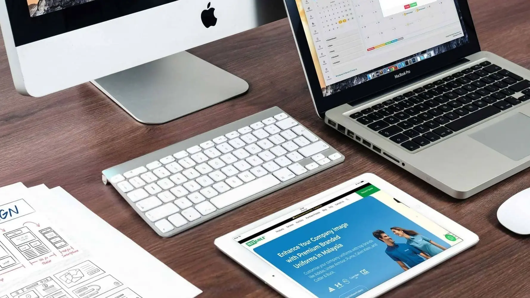 Designer working on website wireframe layout for web design Malaysia project.