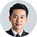 Professional headshot of a male business team member in a dark suit, ideal for a company's executive or leadership page.
