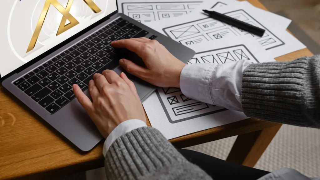 Designer working on website wireframe layout for web design Malaysia project.
